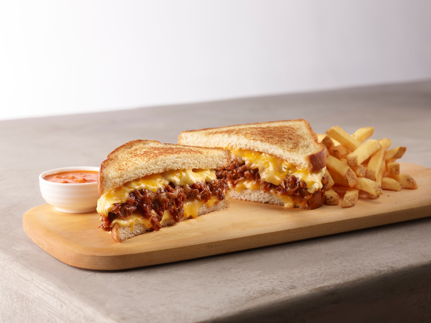 Chopped brisket on thick sliced bread with cheddar, jack and American cheese. Served with crisp fries and tomato bisque dip.