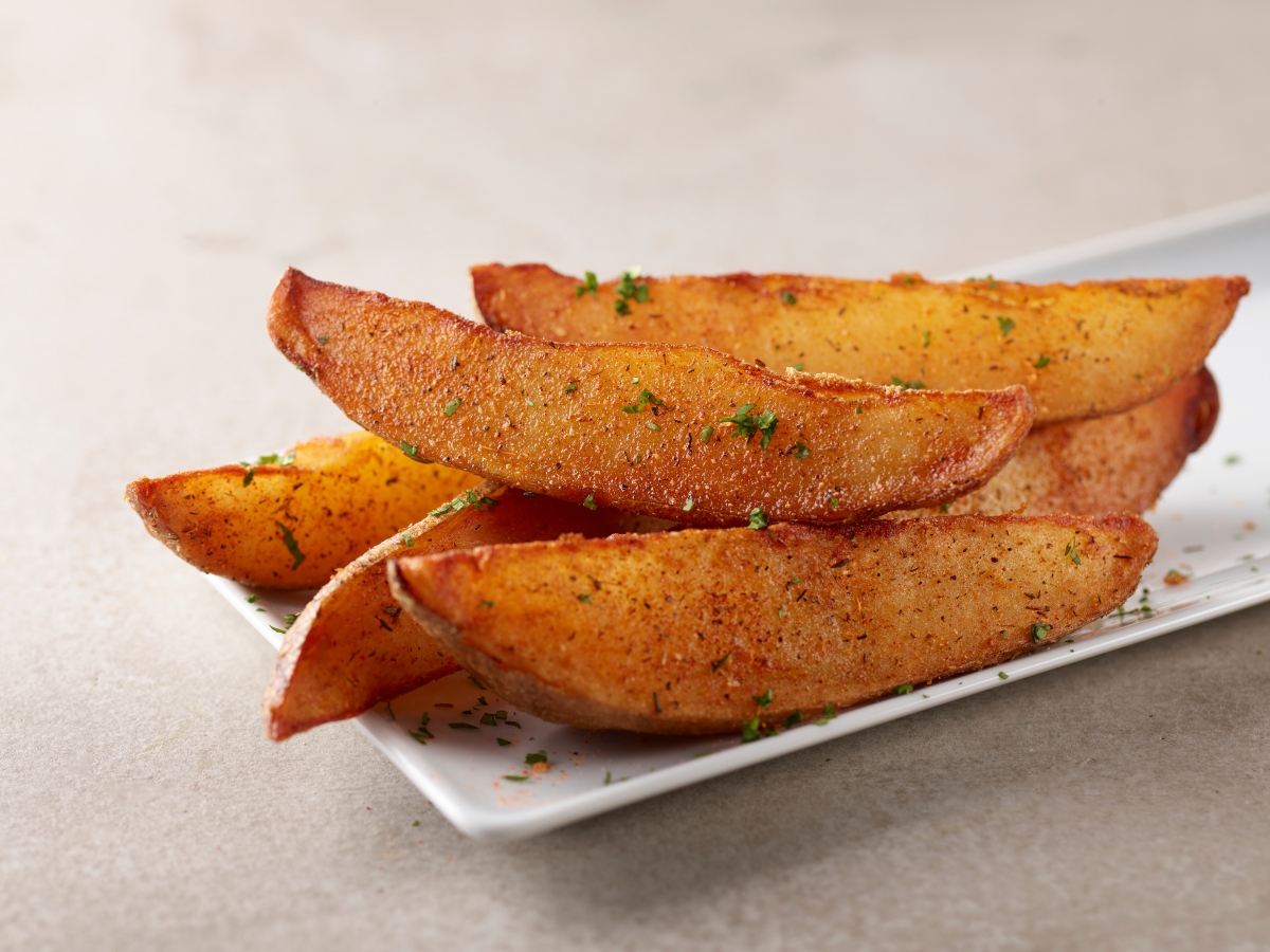 Crispy, golden potato wedges tossed with house seasoning topped with fresh parsley. Like fries, but super-sized.